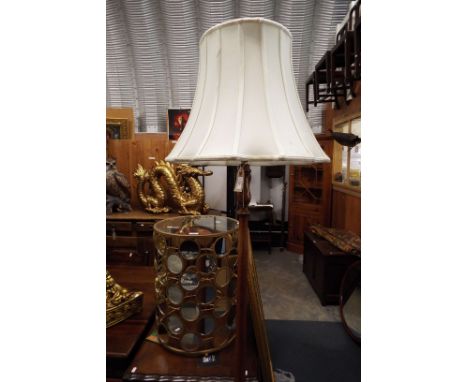 An early 20thC turned walnut standard lamp and shade