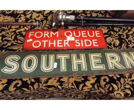 A mid-20thC green enamel Southern Railway sign together with a red enamel bus stop sign 'Form Queue Other Side'