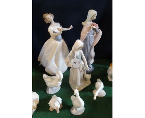 A Lladro figurine of a lady with a butterfly on her hand, no. 6416, together with another similar no. 5171 and five other Lla