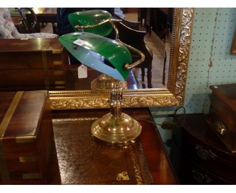 A brass clerk's lamp with adjustable green glass shade (30cm).
