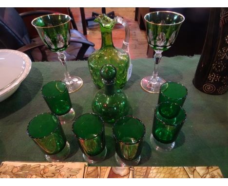 A collection of 19th century and later green coloured glass, to include: small decanter, pair of Bohemian-style goblets and a
