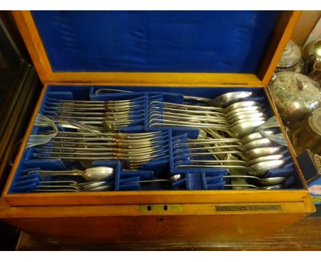 A part canteen of silver plated flatware, contained in a two tier pine box.