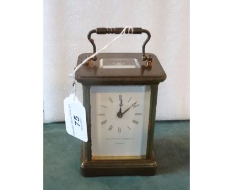 A French gilt brass carriage clock, the five panels with bevelled edge glass, the movement signed Matthew Norman, London (14.