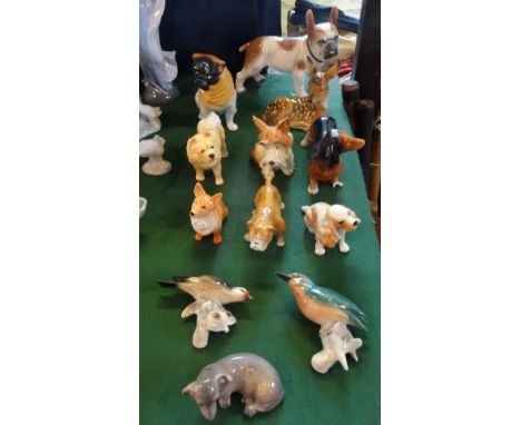 A collection of twelve assorted ceramic animals, to include examples by Sylvac, Royal Copenhagen and others. Condition Report
