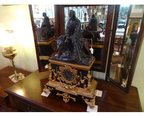 A large 19th century mantel clock with profuse gilt decoration, having allegorical  bronzed surmount, (possibly Daniel and th