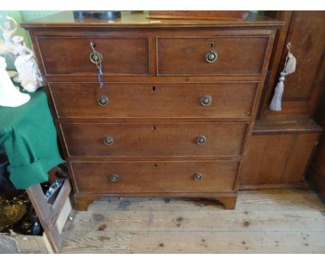 An oak chest, having two short over three graduated drawers on bracket feet (97cm wide).