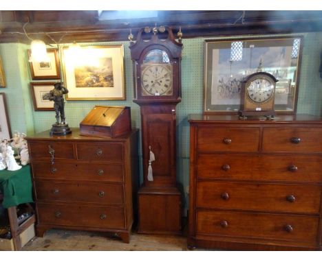 An oak longcase clock, the dial signed Thomas Wilson, Spalding, the eight day movement striking on a bell, the painted dial b