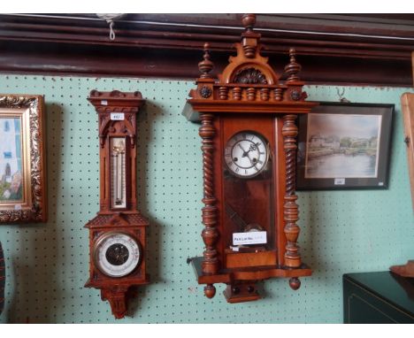 An early 20th century oak aneroid wall barometer, having carved decoration throughout (68cm), together with a mahogany Vienna