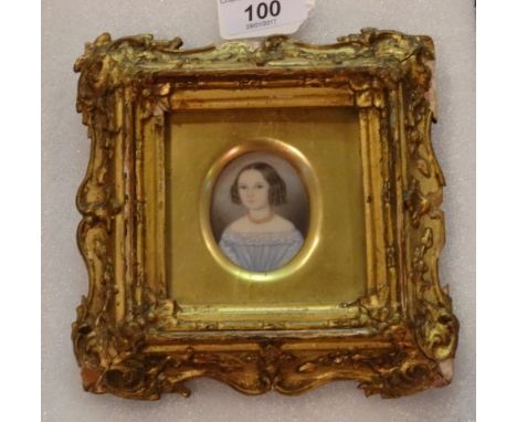 A portrait miniature on ivory, 18th century English school, depicting a young lady in a blue dress and beaded necklace, unsig