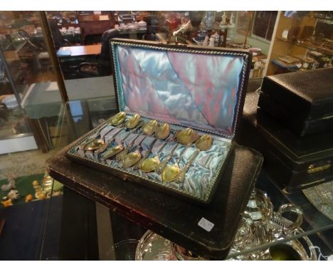 Eleven Continental silver teaspoons in fitted case, together with a cased set of silver handled flatware, a six place setting