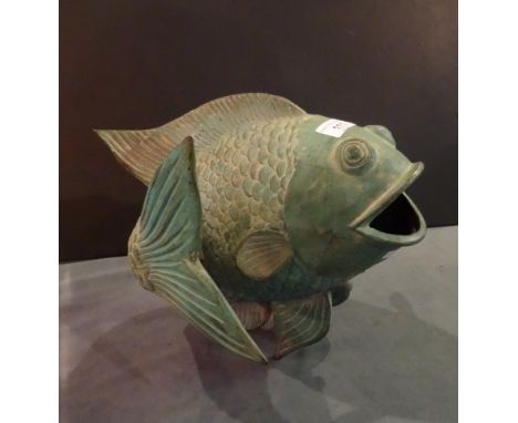 A large green patinated metalware model of a carp (26cm tall).