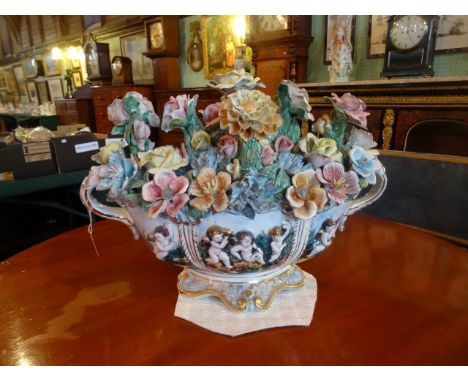 A late 20th century reproduction Continental ceramic flower display (37cm x 49cm).