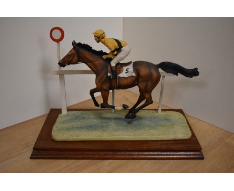 A limited edition Border Fine Arts horse racing study, 'The Finish' L52, depicting race horse and jockey at final post, Desig