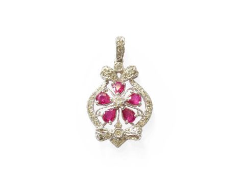 A Ruby and Diamond Pendant, of foliate and bow motif form, set throughout with pear cut rubies and round brilliant cut diamon