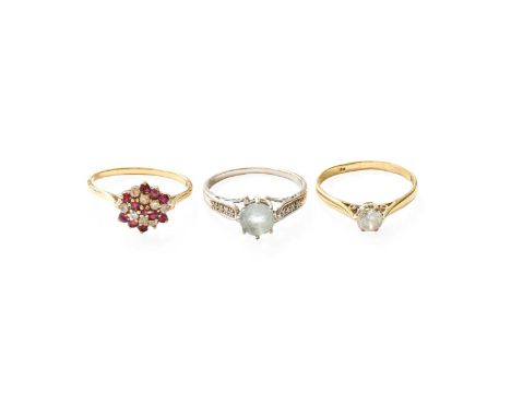 Three Dress Rings, comprising of a 9 carat gold ruby and cubic zirconia ring, finger size S; a 9 carat gold white zircon soli