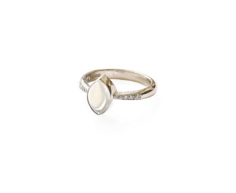 An 18 Carat White Gold Moonstone and Diamond Ring, the cabochon marquise shaped moonstone in a collet setting, to tapered sho