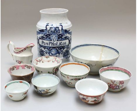 A Dutch Delft Albarello, 18th century, inscribed "Pom P Ho Li Gos" surmounted by a pair of peacocks, basket of fruit and two 