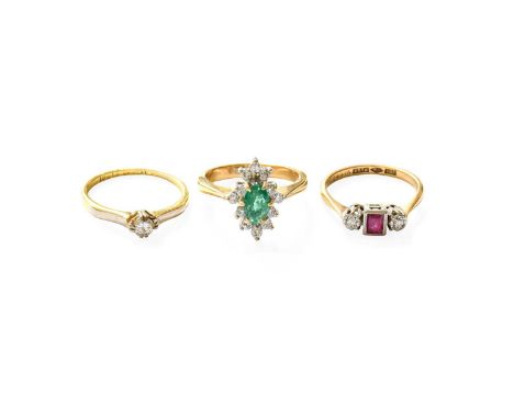 A Ruby and Diamond Three Stone Ring, stamped '9CT' and 'PLAT', finger size K; An Emerald and Diamond Cluster Ring, stamped '1