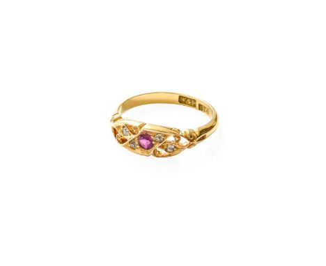 A Ruby and Diamond Five Stone Ring, the round cut ruby flanked by pairs of old cut diamonds, with scrolled shoulders, on a pl