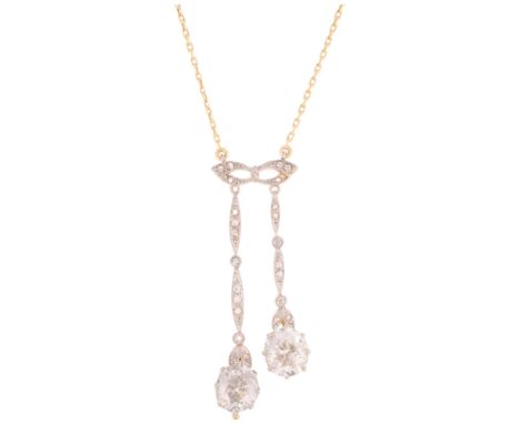 A Belle Epoque Edwardian 18ct gold diamond negligee pendant necklace, circa 1905, the openwork masquerade mask motif suspendi