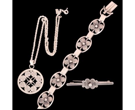 A group of Danish silver Viking Revival spiral jewellery, comprising 19cm bracelet, pendant necklace chain 40cm, and brooch 5