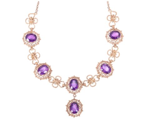 A Vintage 9ct gold amethyst fringe necklace, maker BJ, London 1975, in the Edwardian style, claw set with oval-cut amethysts 