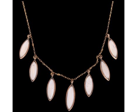 An Art Nouveau 9ct gold moonstone fringe necklace, circa 1910, set with graduated marquise cabochon moonstones, on integral c