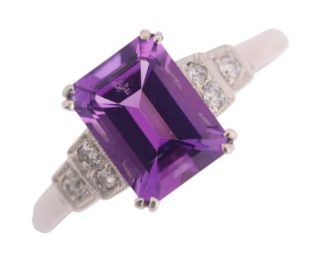 An Art Deco style platinum amethyst and diamond ring, set with octagonal step-cut amethysts and modern round brilliant-cut di