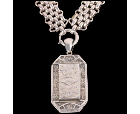 An Antique Victorian Aesthetic Movement silver locket pendant necklace, circa 1880, canted rectangular form, with engraved fl