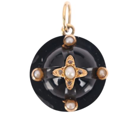 An Antique Victorian onyx split pearl and diamond mourning locket pendant, circa 1880, of round bombe form, centrally star se