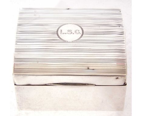 George V rectangular cigarette box, the domed and hinged lid with banded engine turned decoration and initials to a cartouche