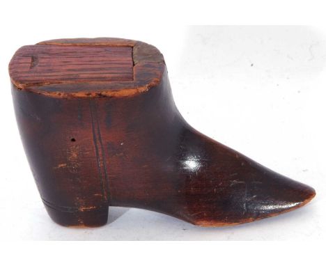 Small 19th century softwood novelty snuff box in the form of a boot, fitted with a slide-off lid, 10cm wide