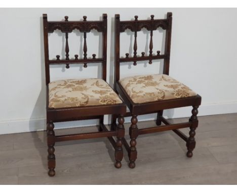 Pair of nicely carved dark Ercol framed chairs