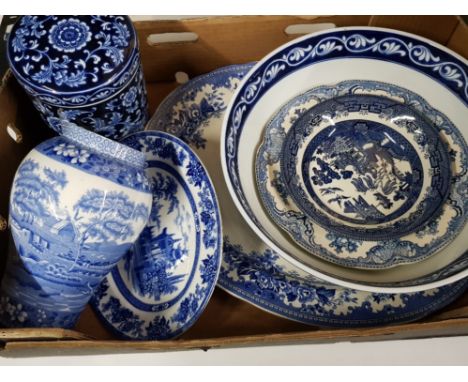 Box containing blue and white bowls and plates, different makers include Doulton, Spode etc