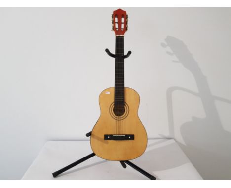 Acoustic guitar on stand