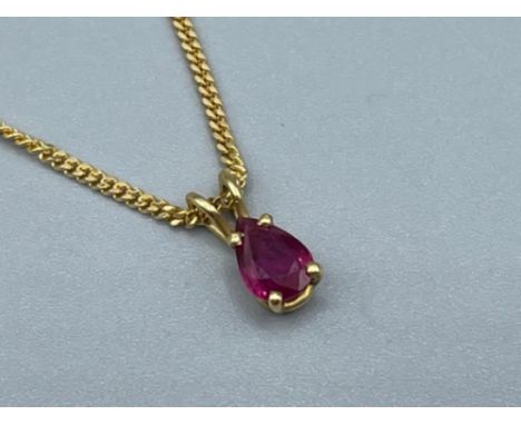 Ladies 18ct gold ruby pendant and chain approx .84ct