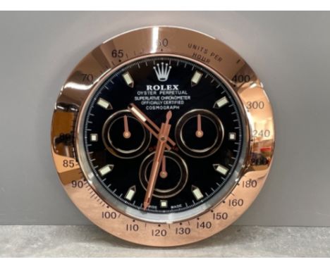 Rose gold colour wall clock in the style of Rolex Daytona