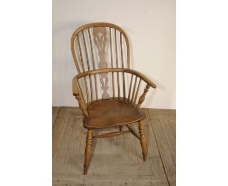 Ash stick back Windsor armchair with pierced central splat and H shaped under stretcher on turned supports 