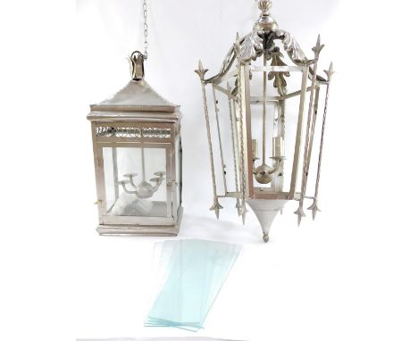 Two silvered finish hanging lanterns, to include a hexagonal large coaching lantern with acanthus leaf hexagonal top and base