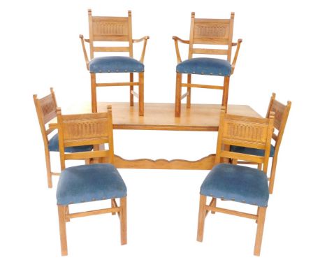 A light oak refectory dining table and chairs, the rectangular extending top on refectory style base, 74cm high, 183cm wide, 