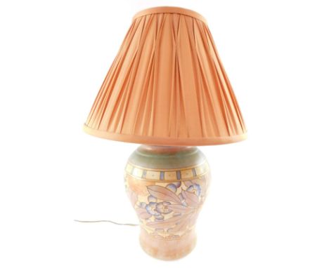 A Charlotte Rhead Burslem ware pottery table lamp, tube line decorated with fruit and leaves, T25, printed mark, with an oran