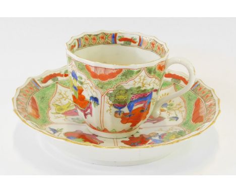 A Worcester First Period porcelain coffee cup and saucer, of fluted form decorated in the Kylins, or Dragons in Compartments 