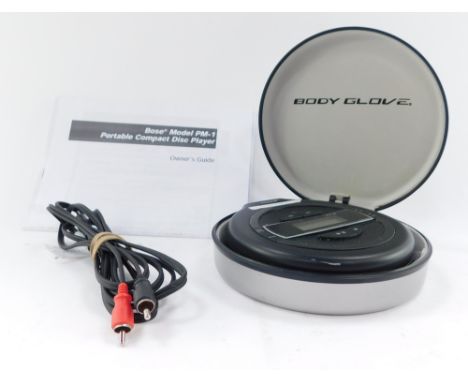 A Bose model PM-1 portable compact disc player, in lack with silvered case. 