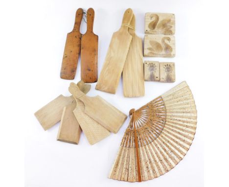 A group of wooden butter pats, together with butter moulds decorated with swans, and sheaths of corn, and a 19thC floral pain