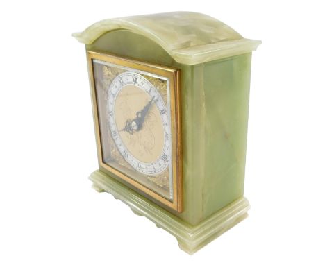 An Elliott green onyx mantel clock, engraved square brass dial with cherub spandrels, silvered chapter ring bearing Roman num