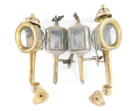 A pair of brass carriage lamps, of canted square form surmounted with eagles, converted to electricity, 37cm high, and a furt