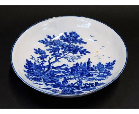 A Worcester First Period blue and white porcelain saucer, circa 1775-85, decorated in the European Landscape pattern, hatched