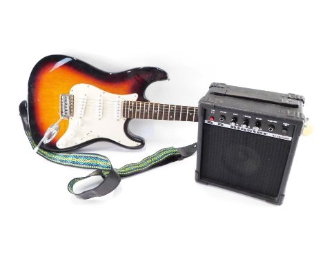 An Aris STG series electric guitar, and a Blaster amplifier. (2)