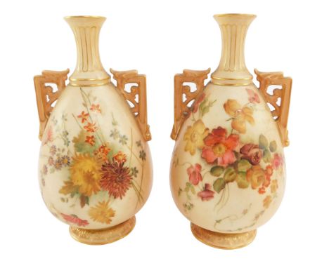 A pair of Royal Worcester blush porcelain vases, circa 1902, of twin handled baluster form, painted with meadow flowers, prin