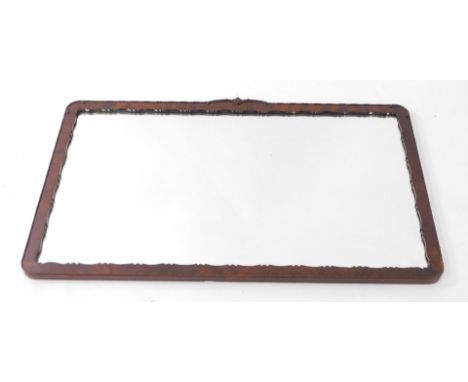 An early 20thC rectangular mahogany wall mirror, with ribbed and beaded mahogany frame, with crest to top, 60cm high, 100cm w